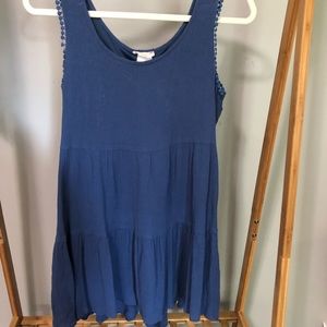 Blue high low dress with detailing around arms